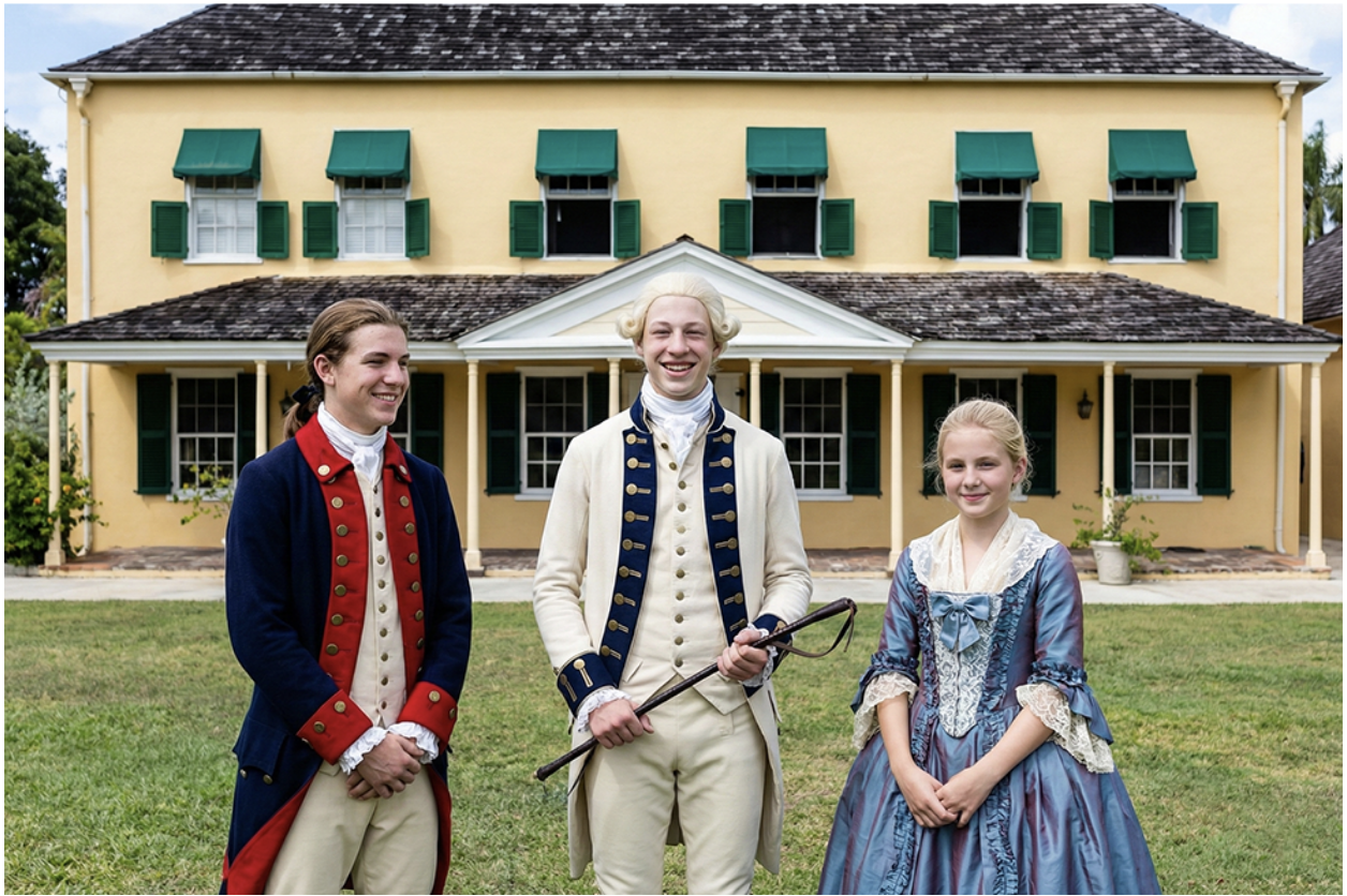A young George Washington standing with friends in front of the George Washington House in Barbados.